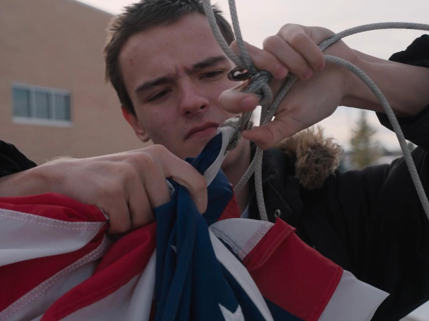 Elias Wallace folded a flag as part of his school's R.O.T.C. program. 