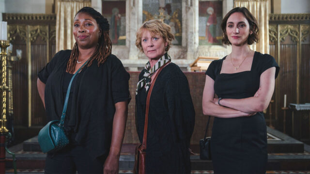 Color photo of actors (from left) Jo Martin in costume as Suzie Harris, Samantha Bond as Judith Potts, and Cara Morgan as Becks Starling in the cozy crime drama, The Marlow Murder Club, on MASTERPIECE on PBS.